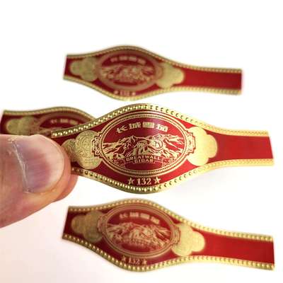 खरीदें Custom Round Rectangular Oval Cigar Band Label with Gold Foil Stamping and Embossed Design online manufacture