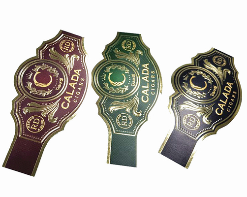 अच्छी कीमत कस्टम लेबल स्टिकर गर्म बिक्री सिगार लेबल स्टिकर एम्बोसिंग मुद्रित अद्वितीय आकार यूवी गोल्ड सिगार रिंग लेबल चिपकने वाला जलरोधक कार्टून लेबल मुद्रण स्टिकर ऑनलाइन